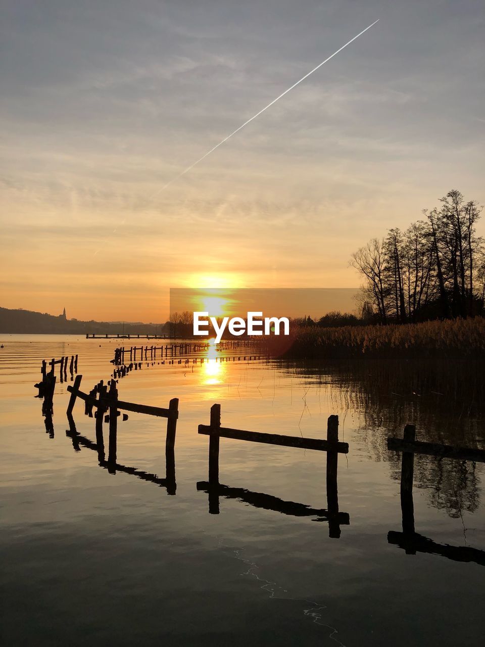 Scenic view of lake against sky during sunset