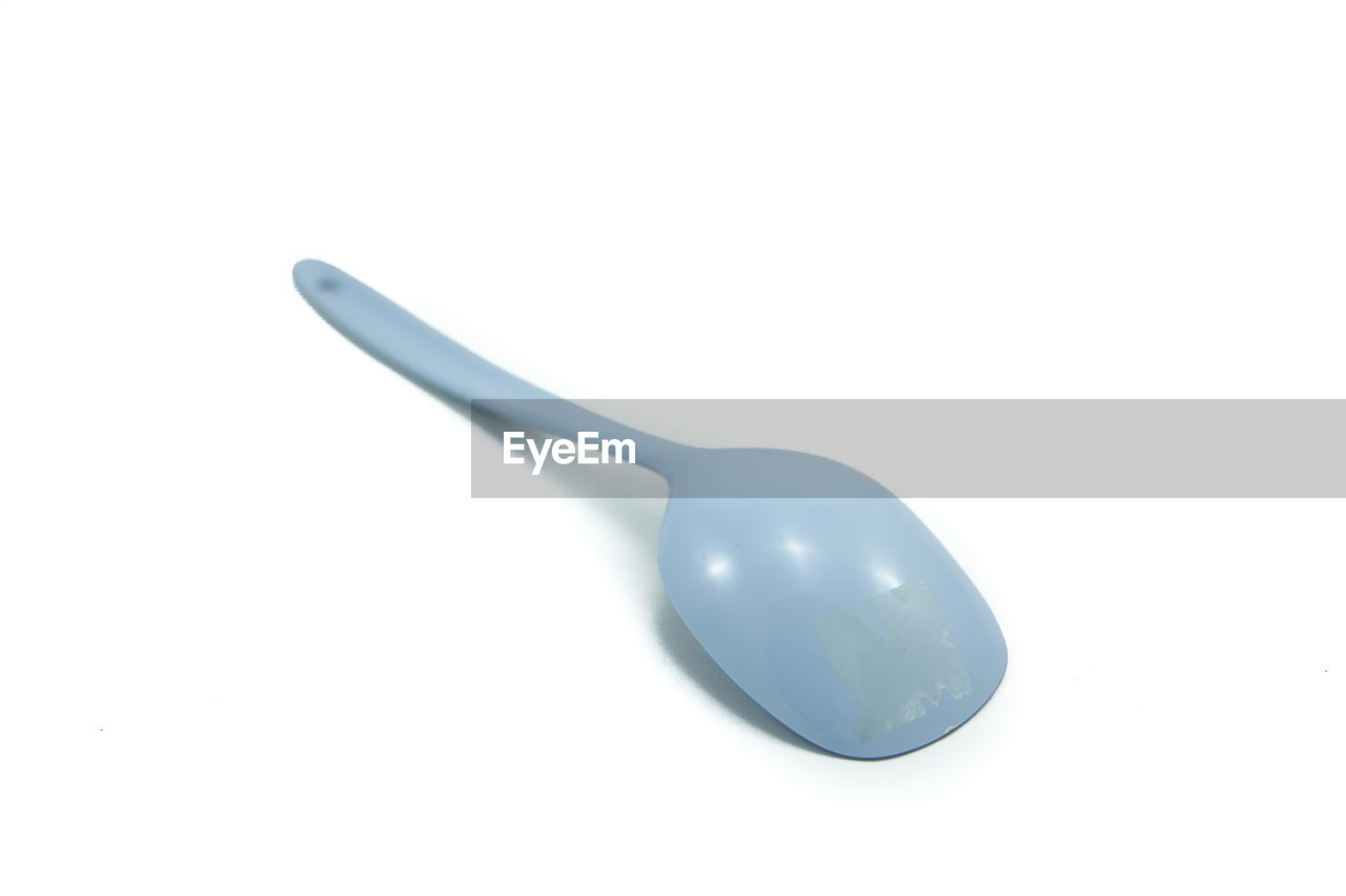 High angle view of spoon against white background