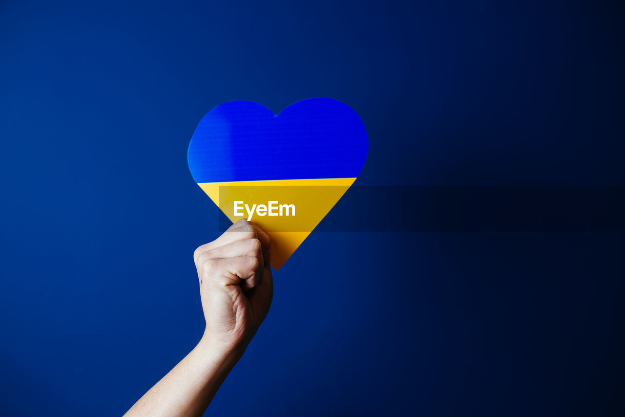 Flag of ukraine in a heart shape. image showing support for the people during war. 