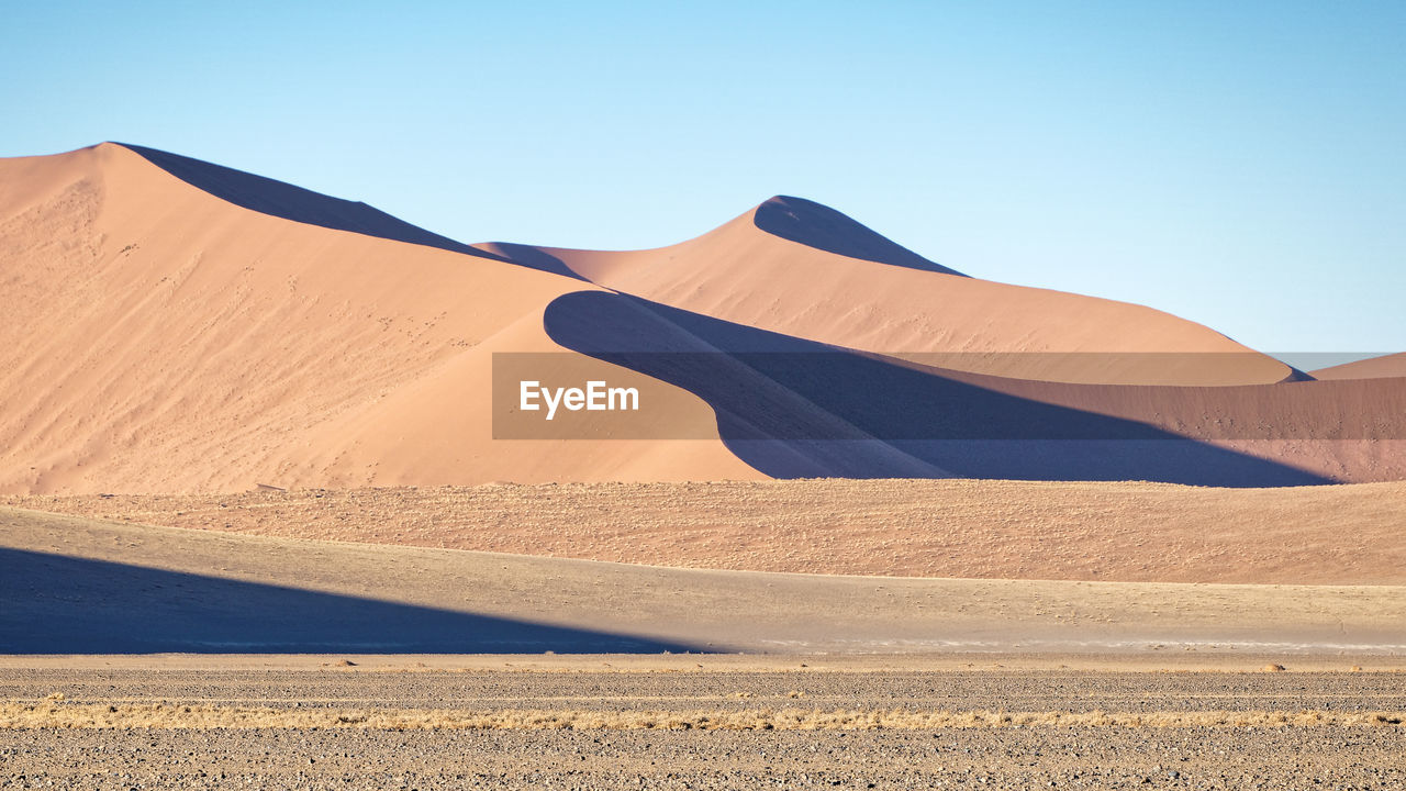 Scenic view of desert against clear sky