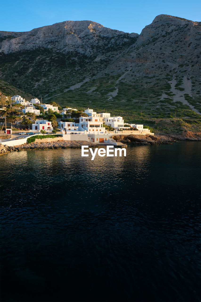 Kamares town with traditional white houses on sifnos island on sunset. greece