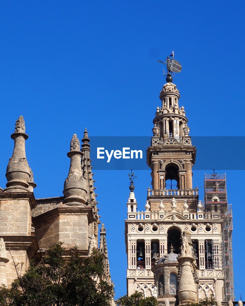 LOW ANGLE VIEW OF CHURCH AGAINST BLUE SKY