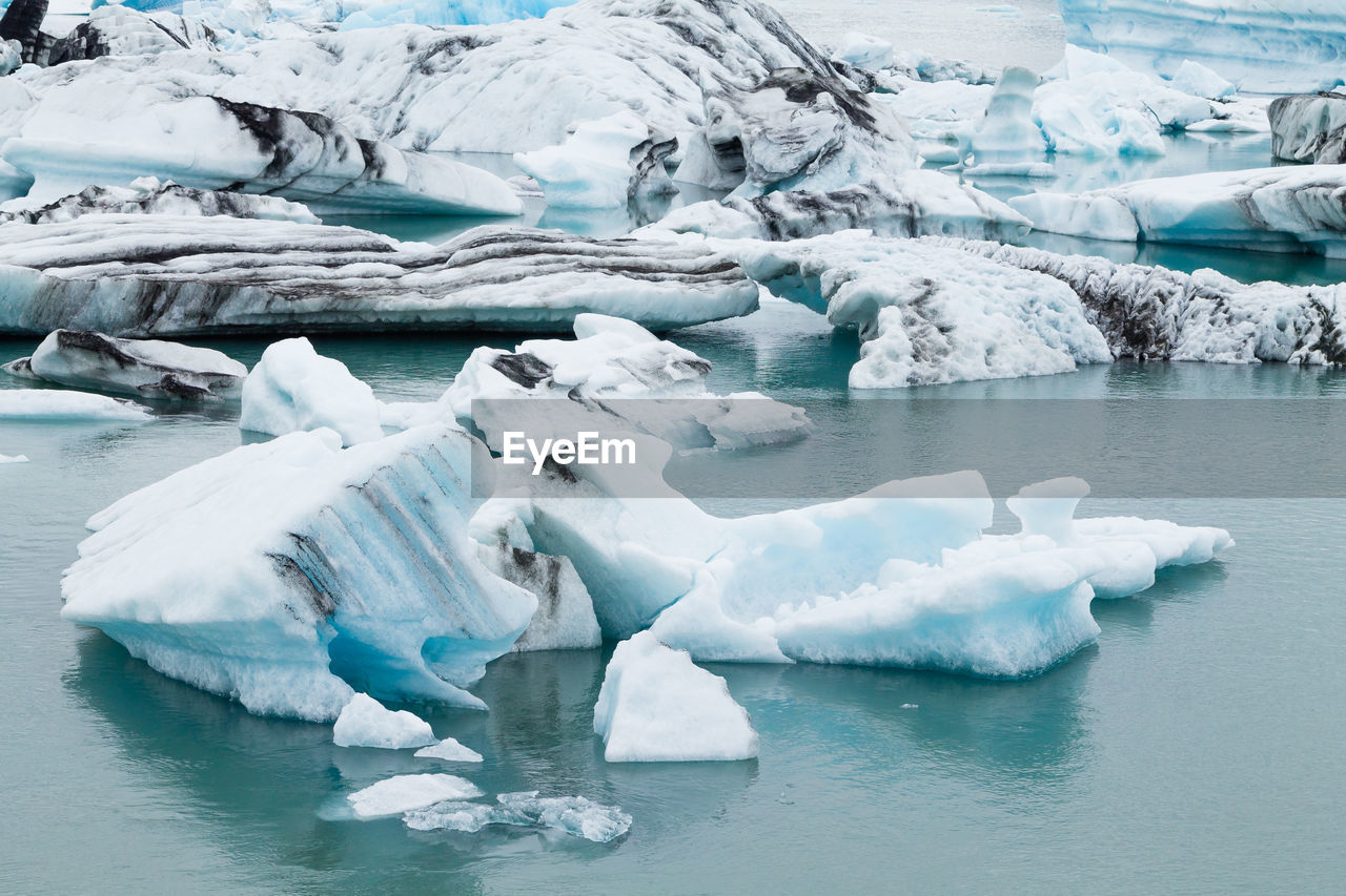 Icebergs in frozen sea 