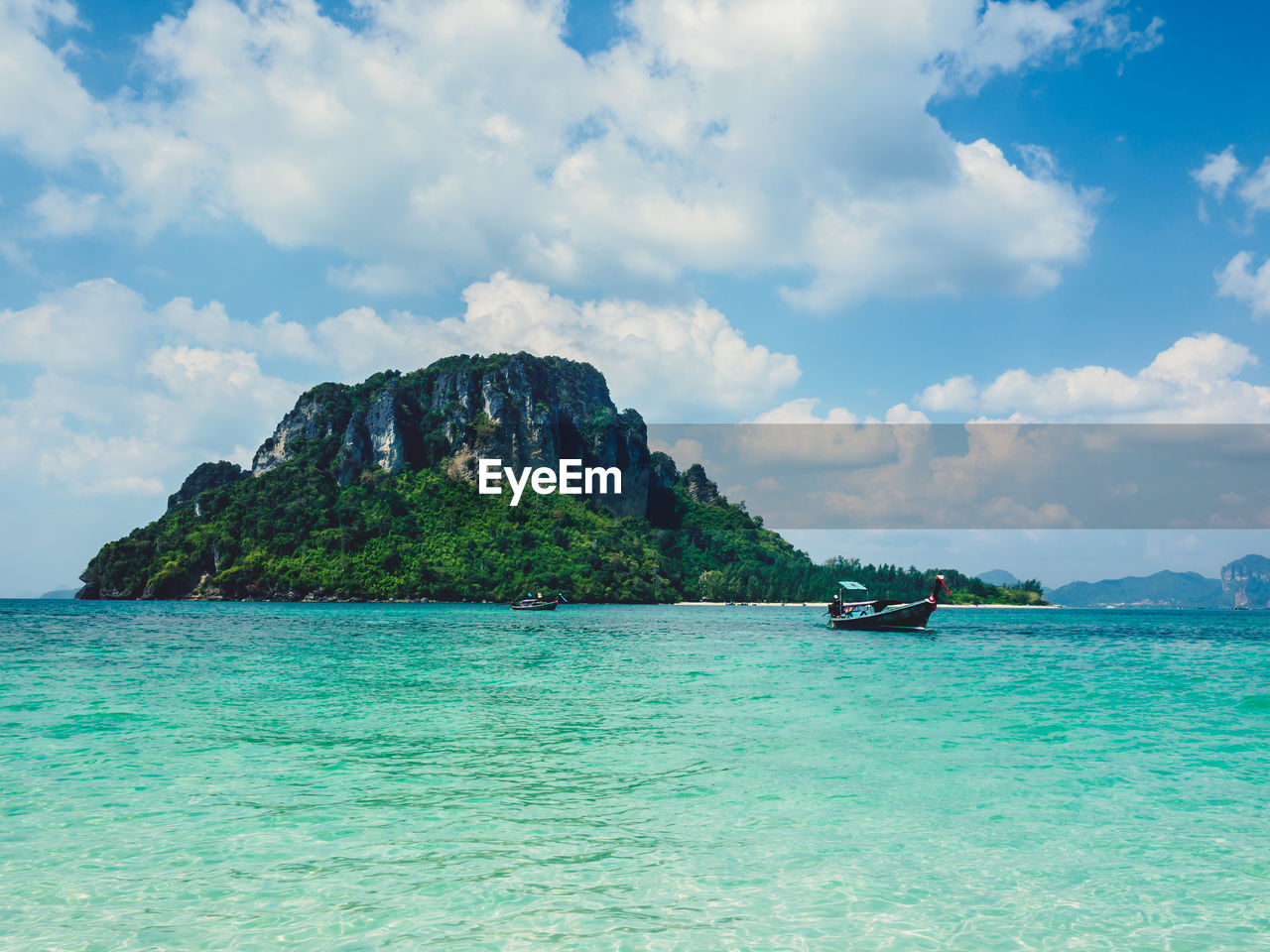 SCENIC VIEW OF SEA AND ROCK FORMATIONS AGAINST SKY