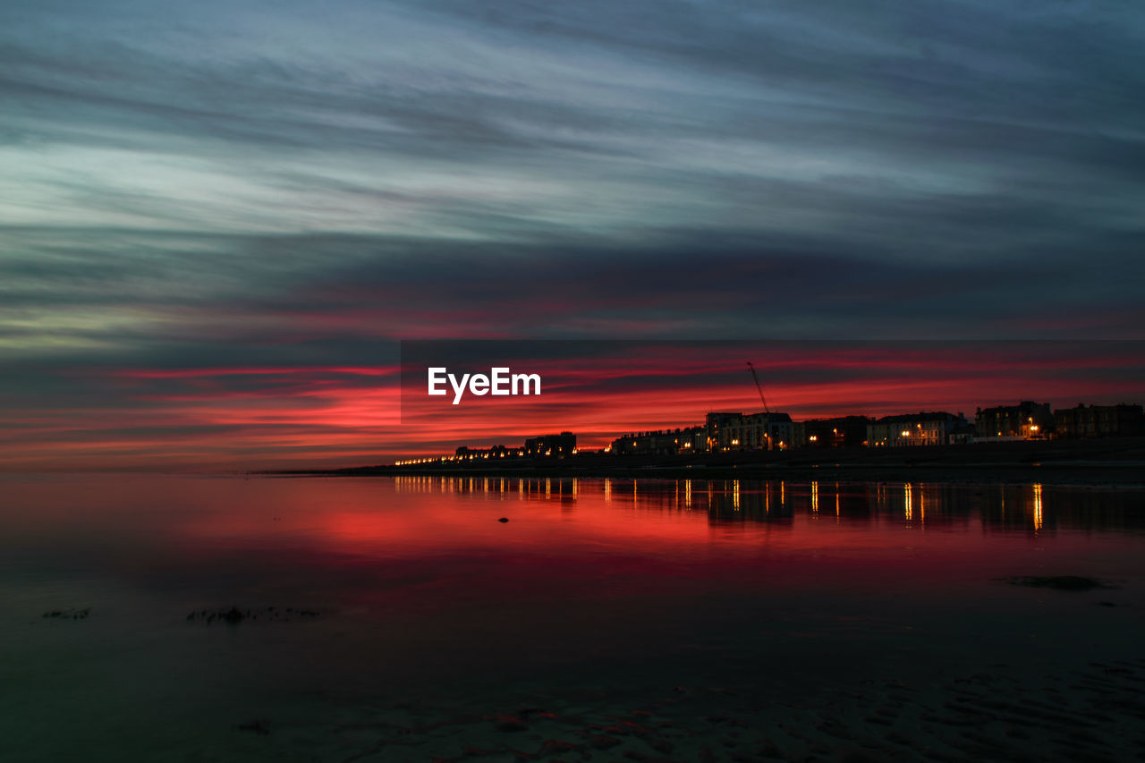 SCENIC VIEW OF SEA AGAINST ORANGE SKY