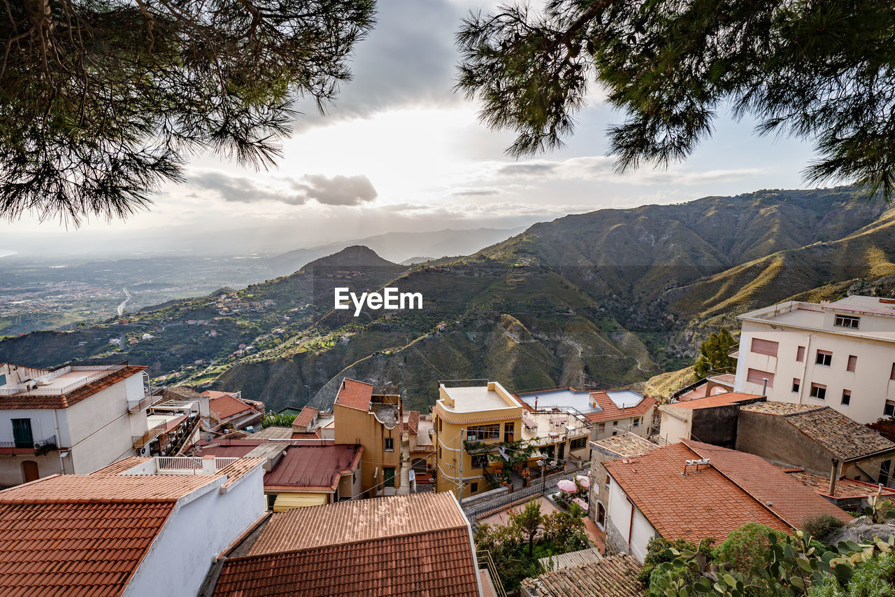 High angle view of houses with mountains in background