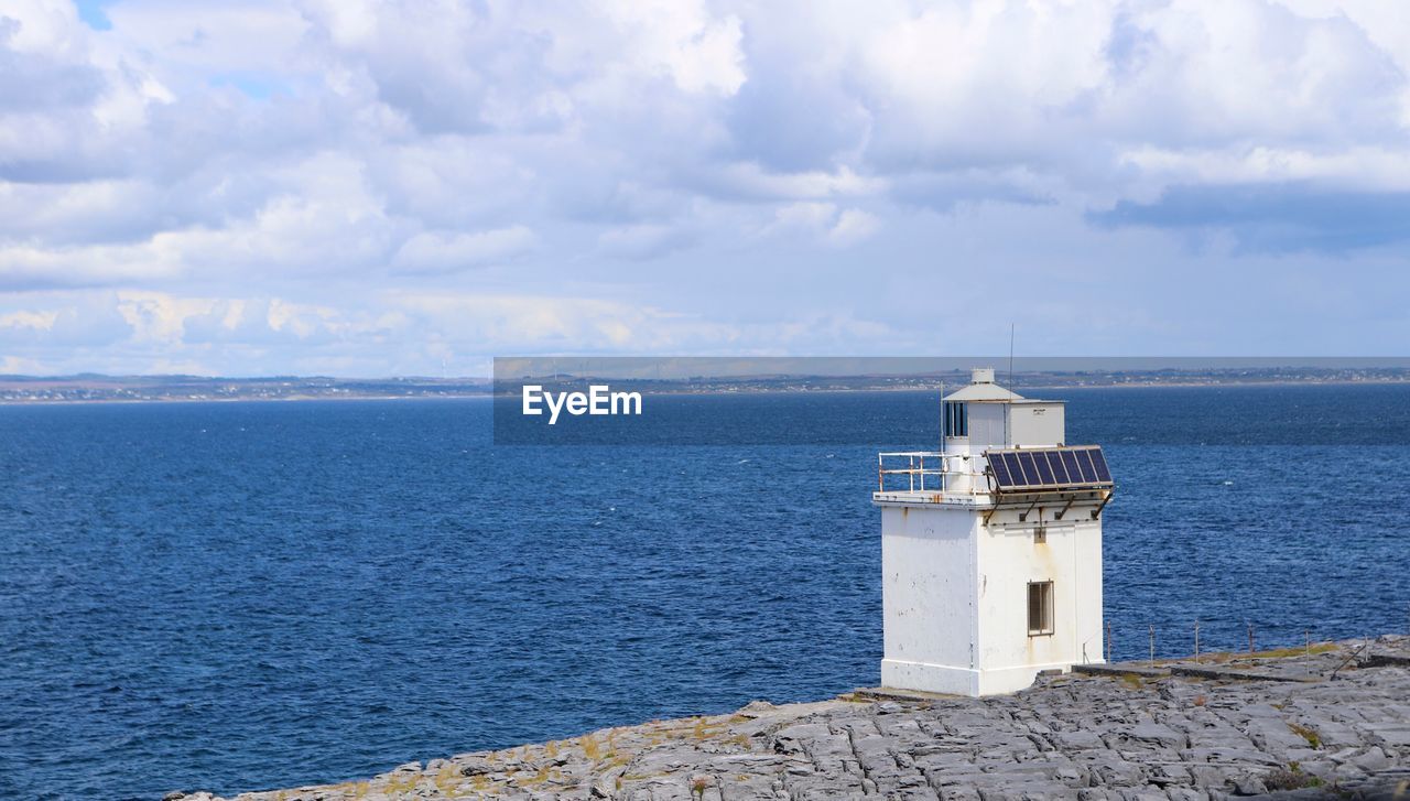 LIGHTHOUSE AGAINST SKY