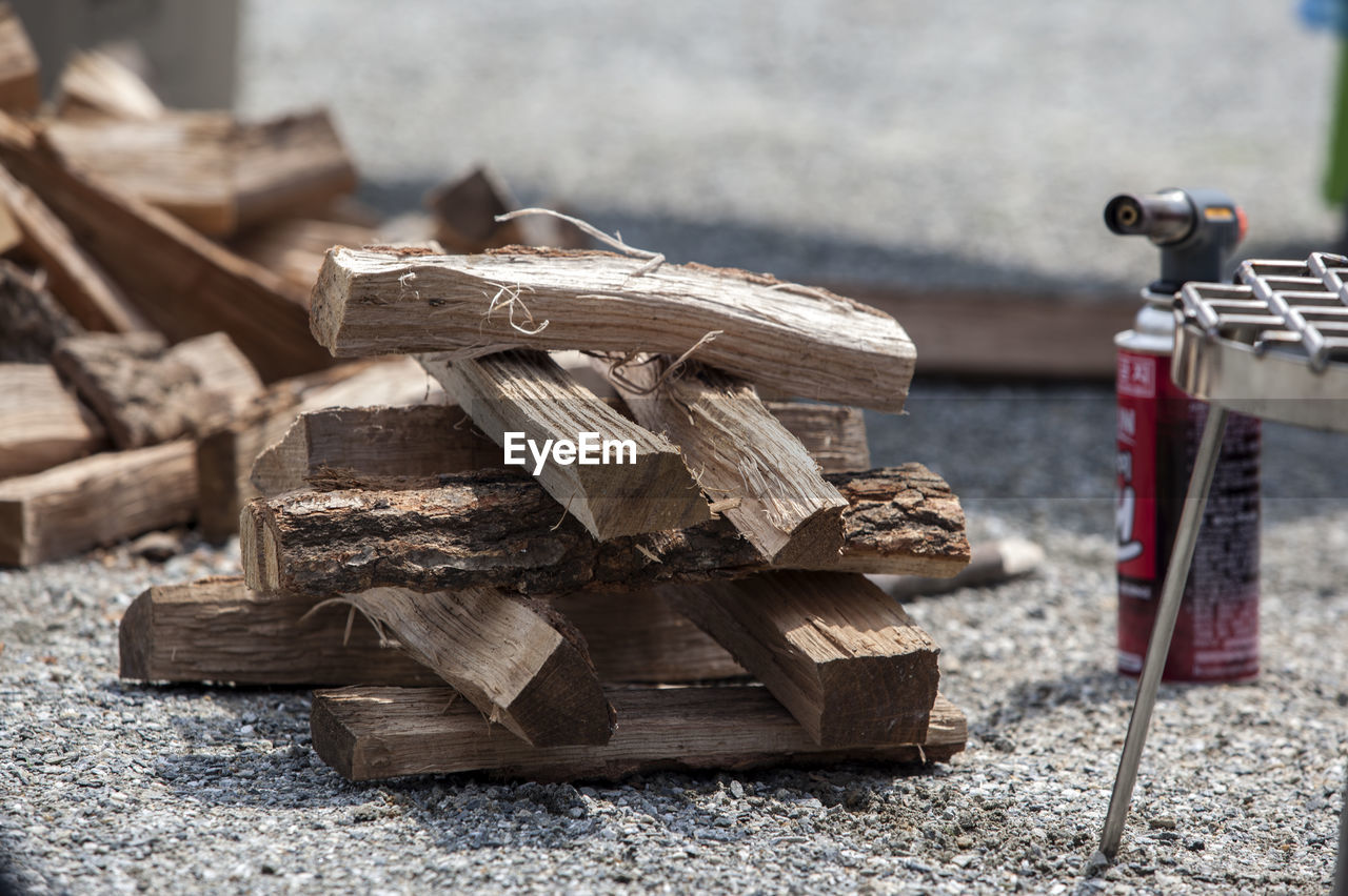 Stack of firewood on field