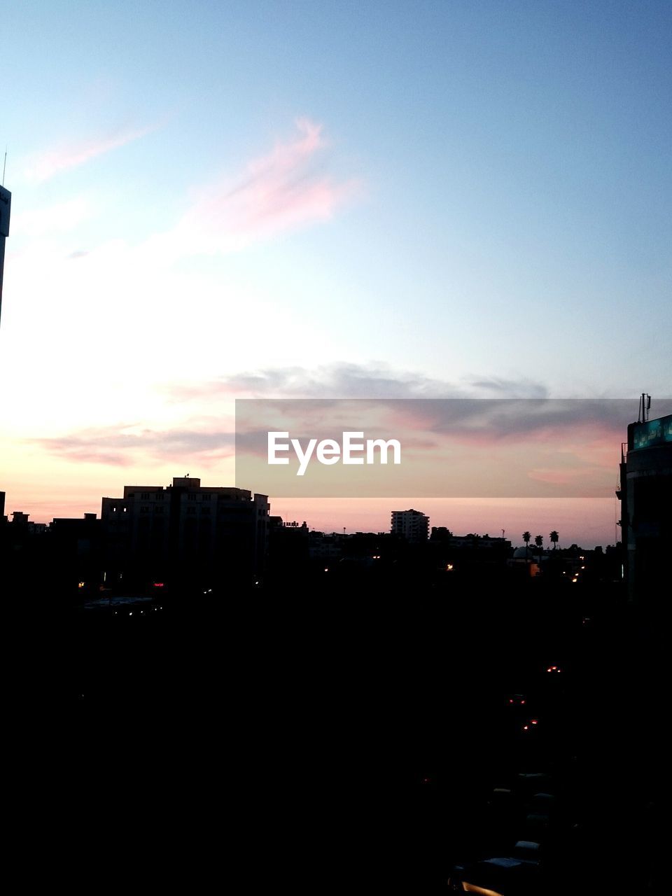 VIEW OF BUILDINGS AT SUNSET