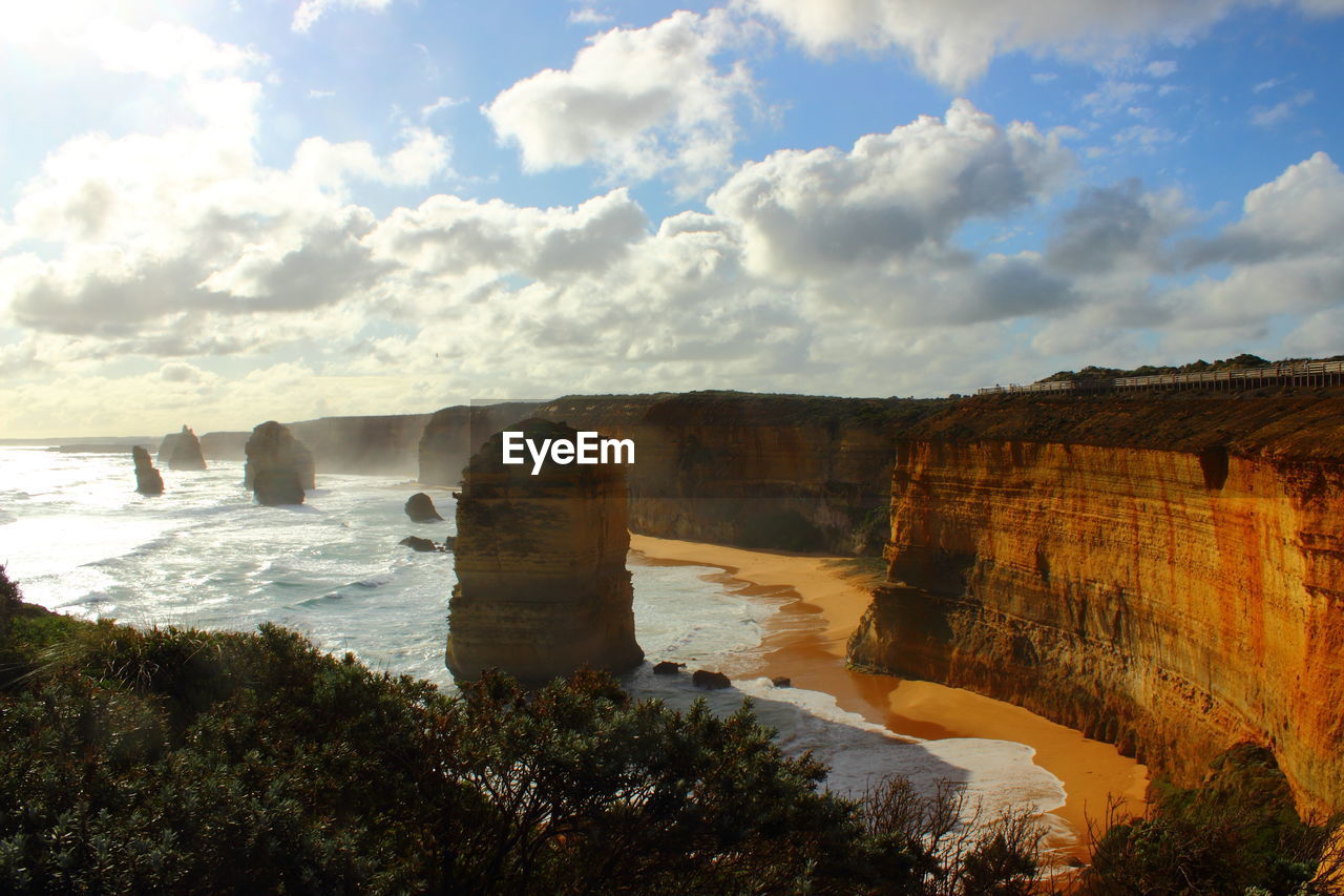 Scenic view of cliff against sky