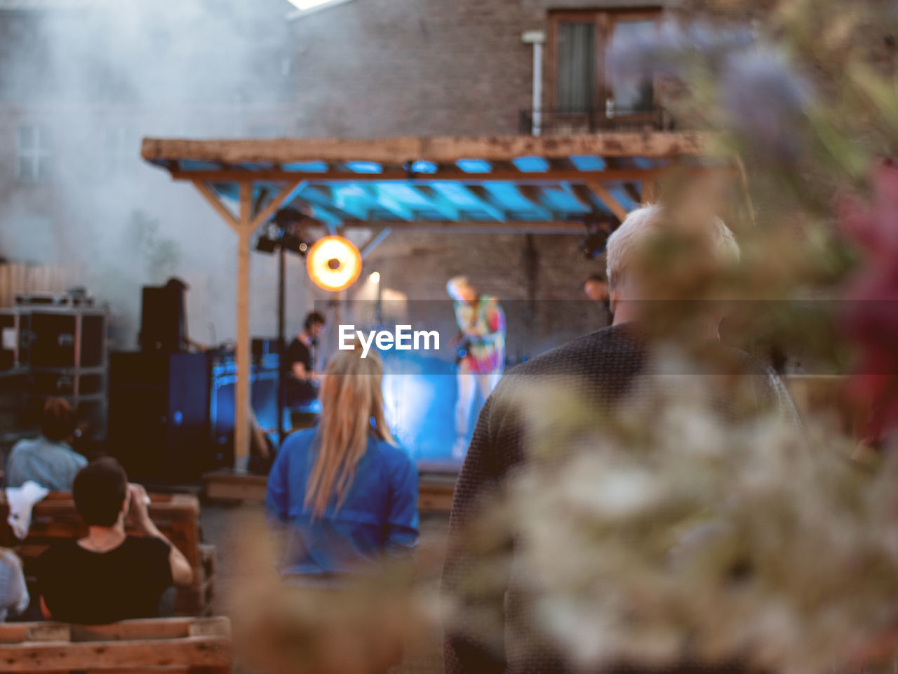 group of people, adult, selective focus, focus on background, women, men, medium group of people, crowd, ceremony, food and drink, business, architecture, smoke, young adult, meal, enjoyment, indoors