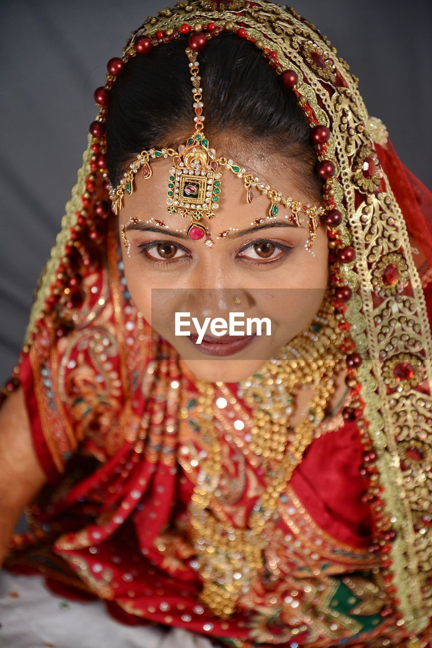 Portrait of beautiful young bride at home