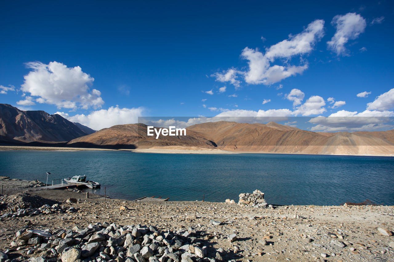 Scenic view of sea against blue sky