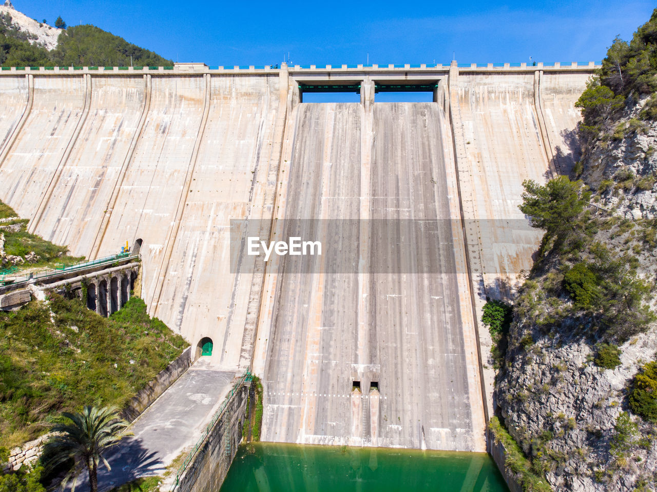 HIGH ANGLE VIEW OF DAM BY RIVER