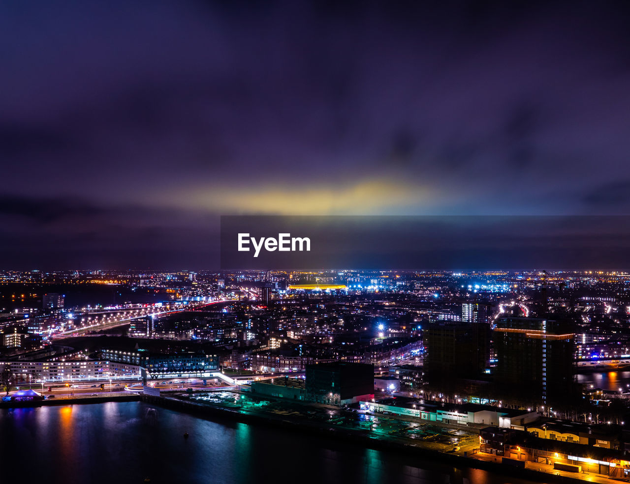 High angle view of illuminated buildings in city at night