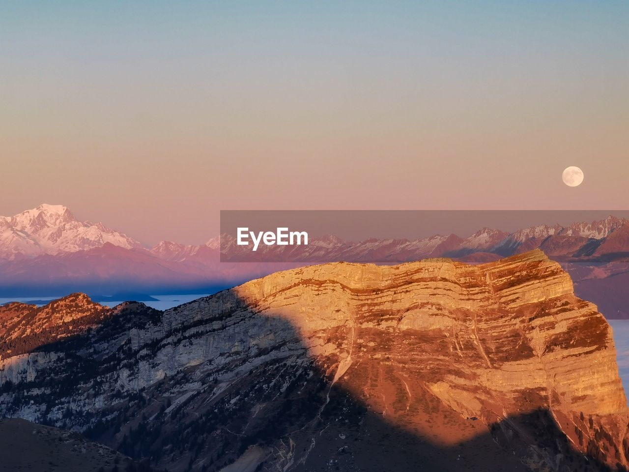 Scenic view of mountains against sky during sunset