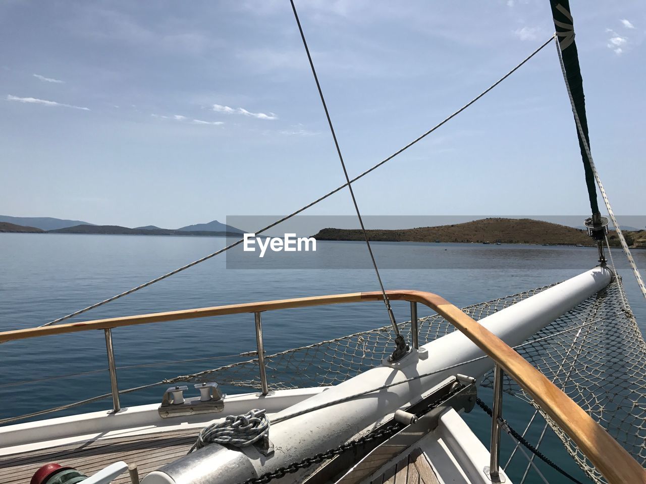 Boats sailing on sea against sky