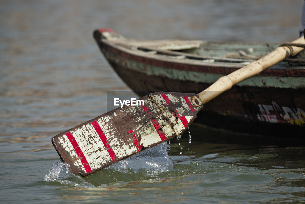 HIGH ANGLE VIEW OF BOAT ON RIVER AGAINST THE SKY