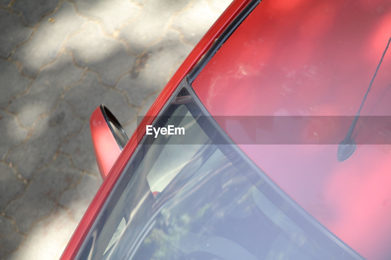 High angle view of car parked on footpath