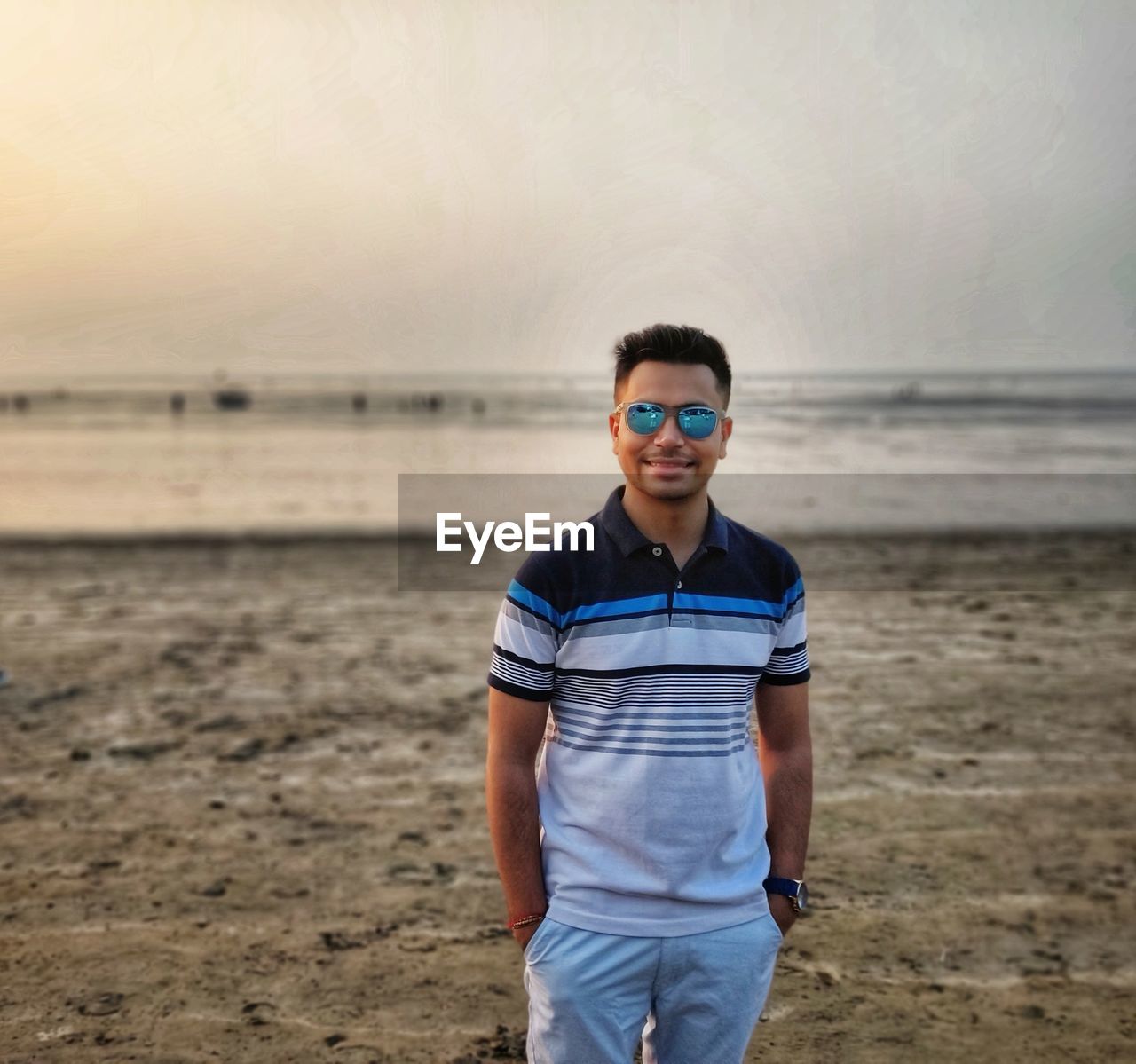 Portrait of boy standing on beach