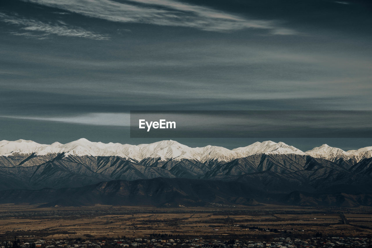 SNOWCAPPED MOUNTAINS AGAINST SKY