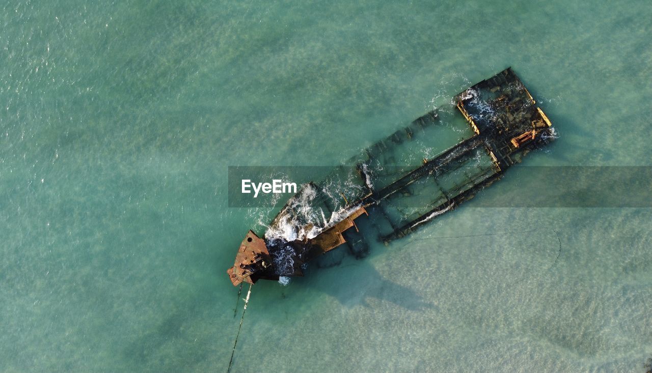 Aerial view of shipwreck in sea