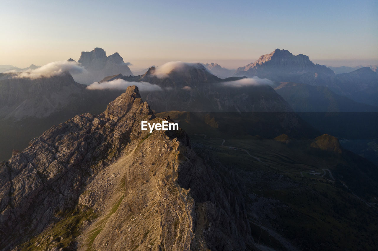 Scenic view of snowcapped mountains against sky during sunset