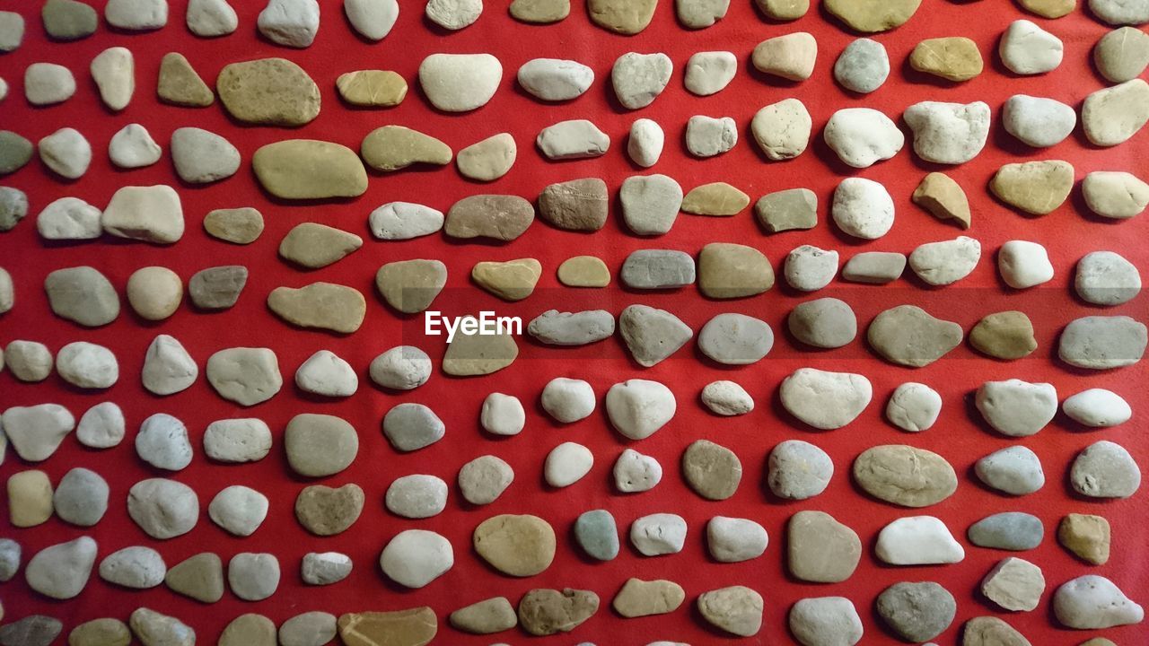 Full frame shot of pebbles on table