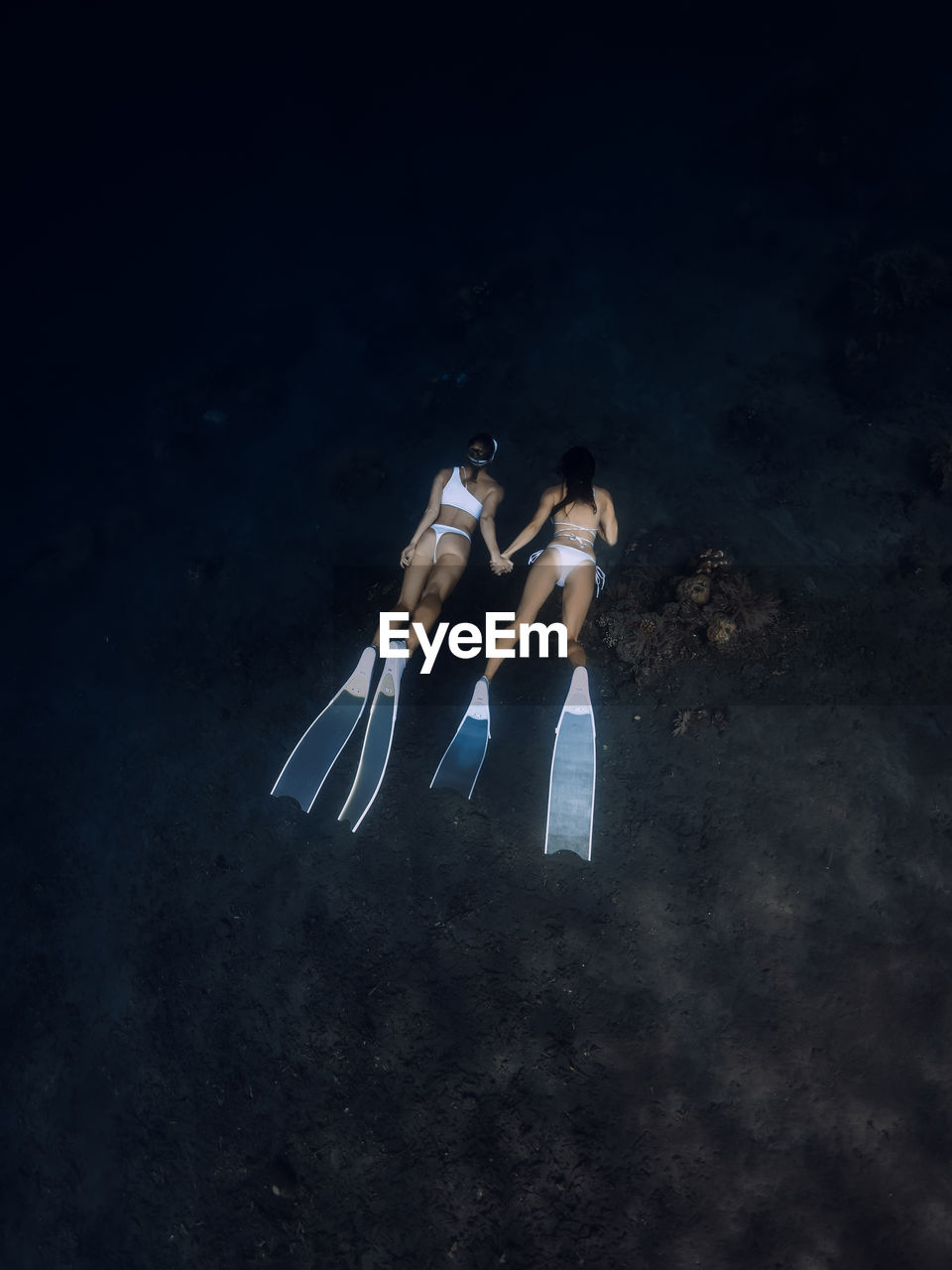 high angle view of young man swimming in sea