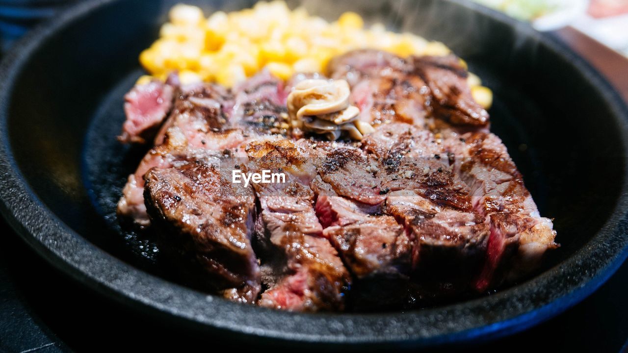 Close-up of meat in frying pan