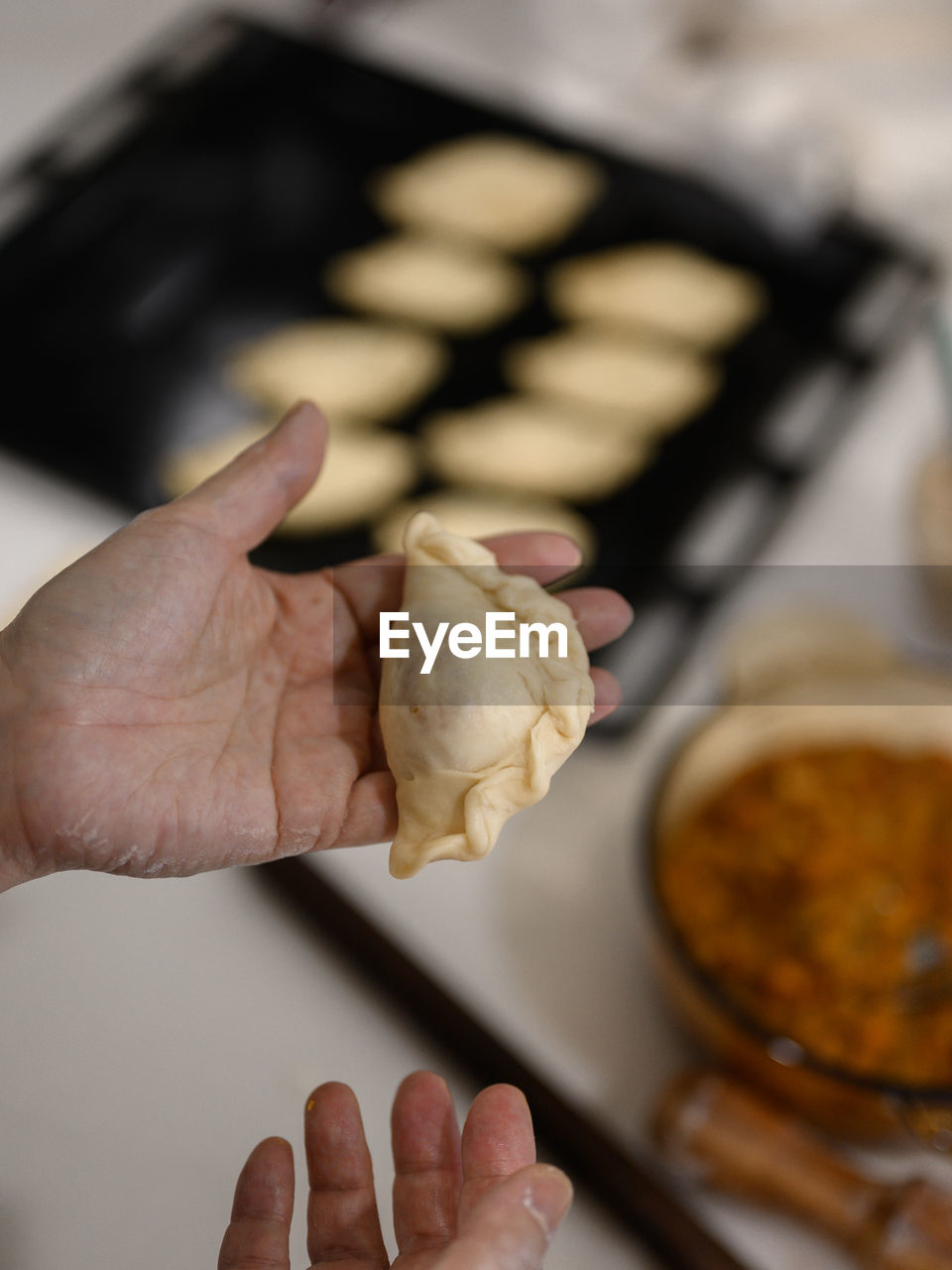 Cropped image of person preparing food