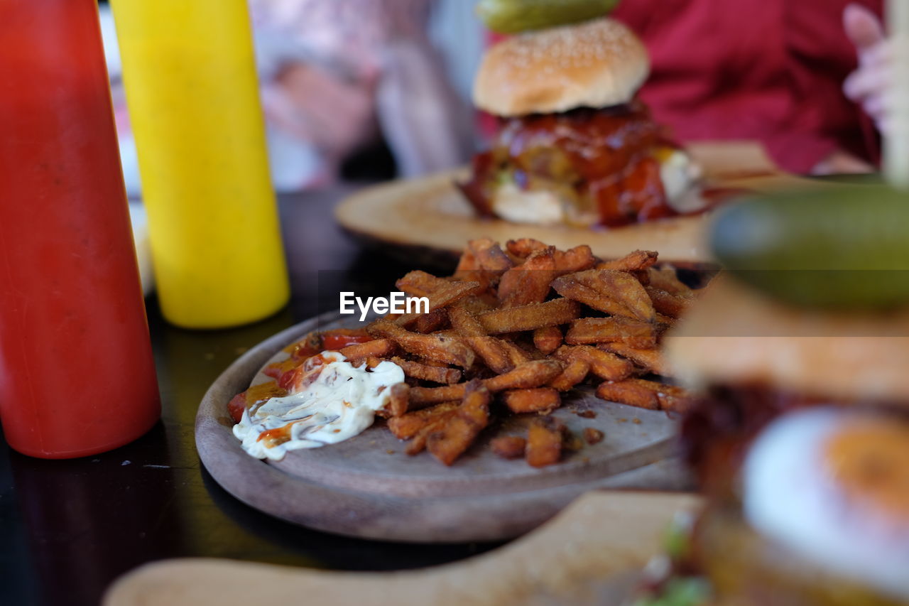 French fries on serving tray at table