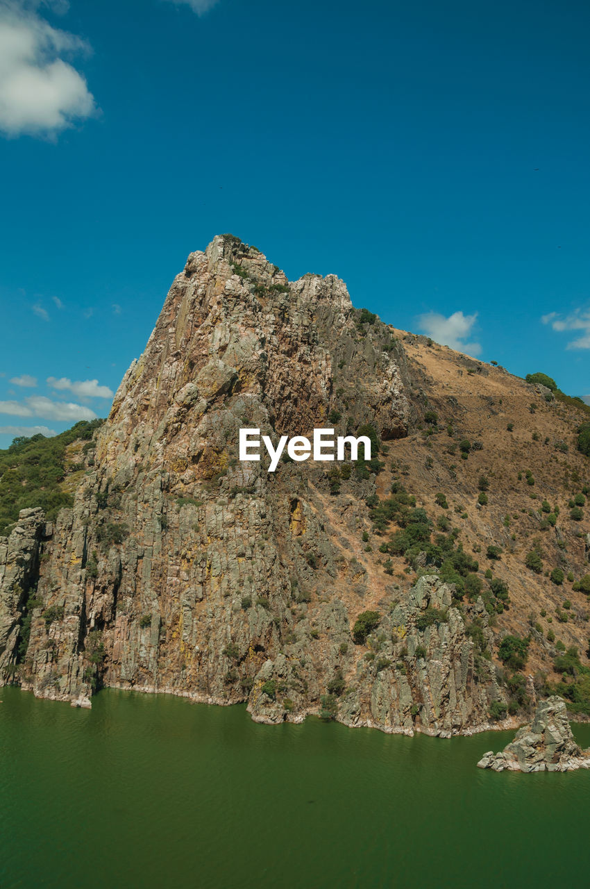 ROCK FORMATIONS AGAINST SKY