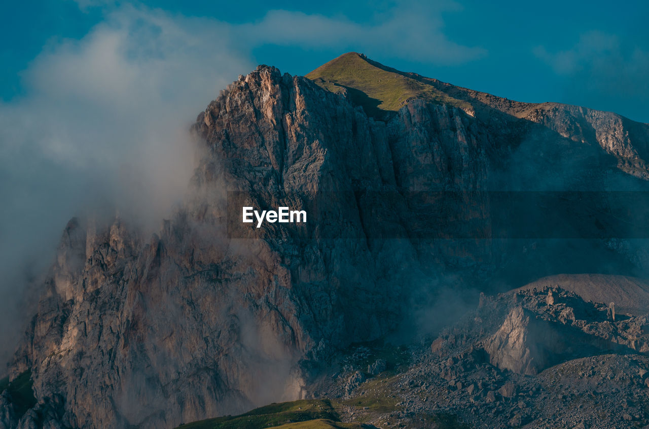 Panoramic view of volcanic mountain range against sky