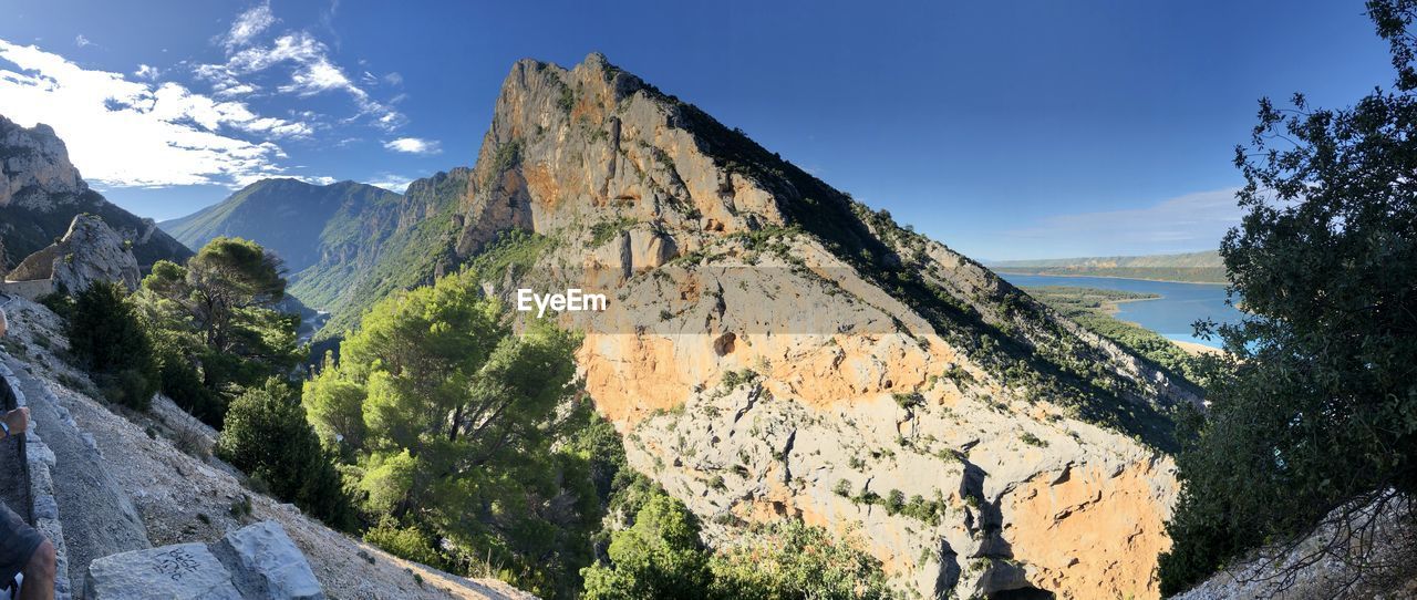 Panoramic view of rocks and mountains against sky