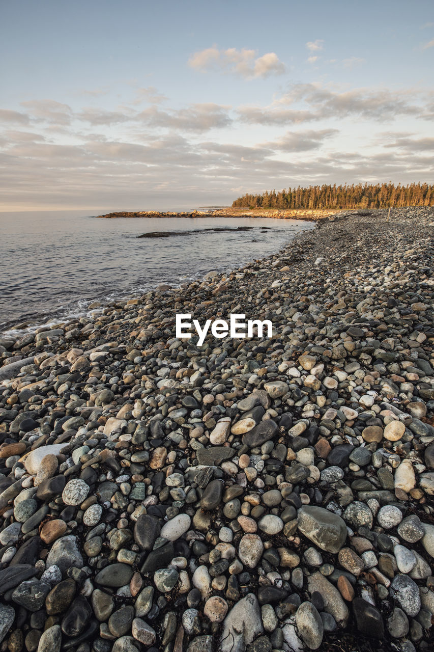 Sunrise at rocky beach on atlantic ocean, acadia national park, maine