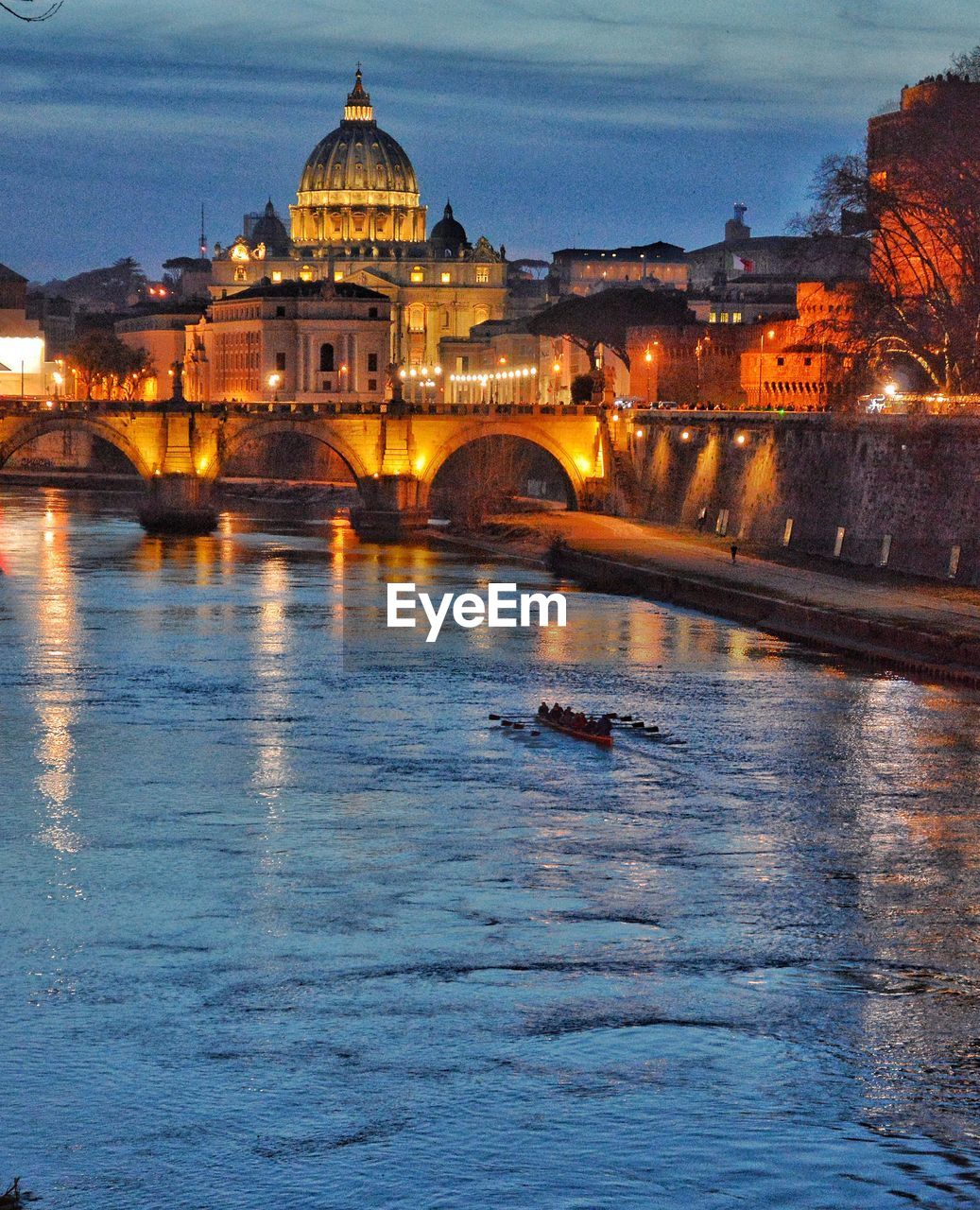 ILLUMINATED BUILDINGS AGAINST SKY