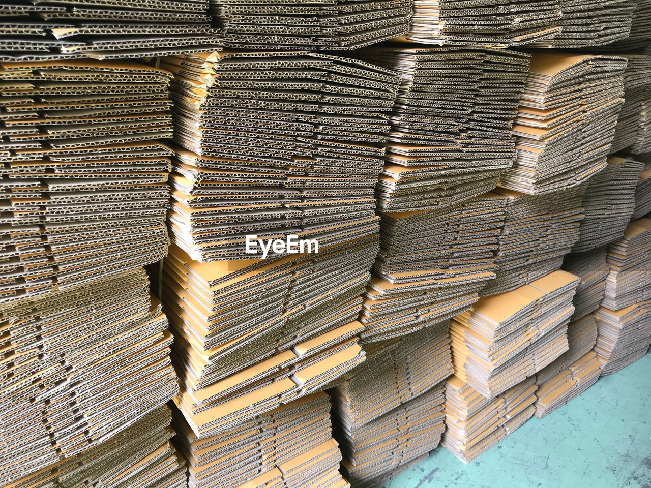 Cardboard sheets stacked in warehouse