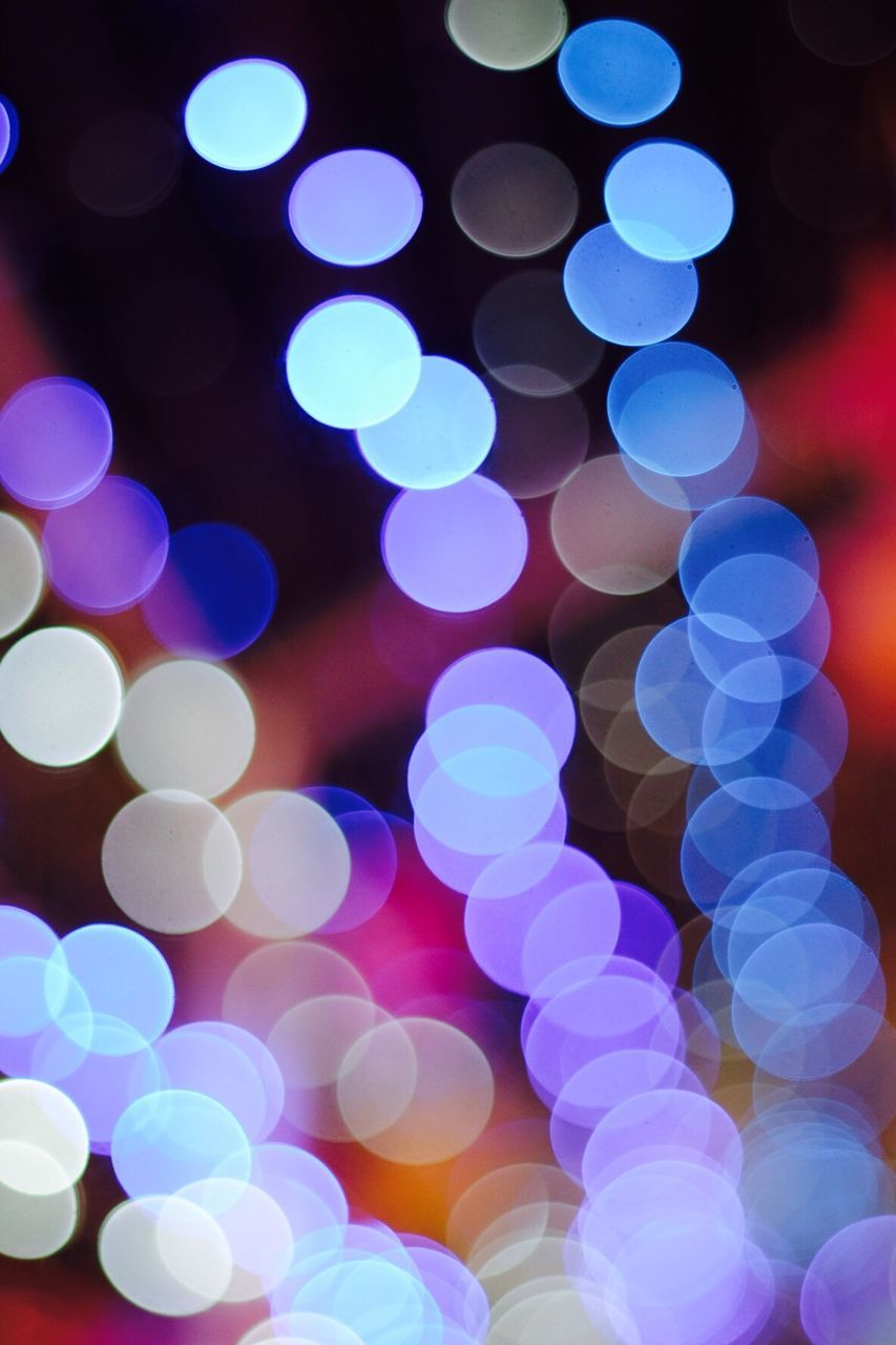 Defocused image of colorful illuminated lights at night