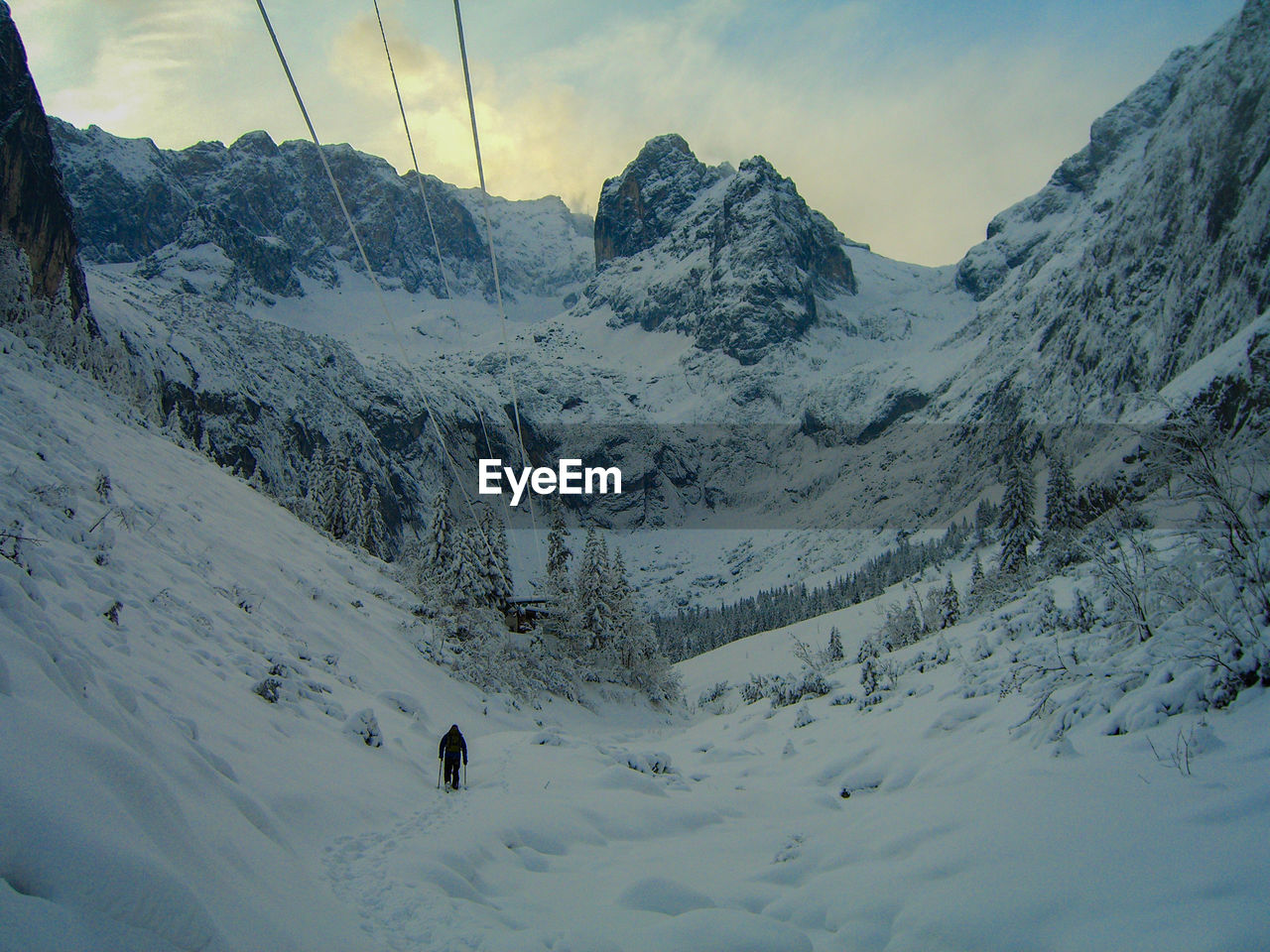 TOURISTS ON SNOW COVERED MOUNTAINS