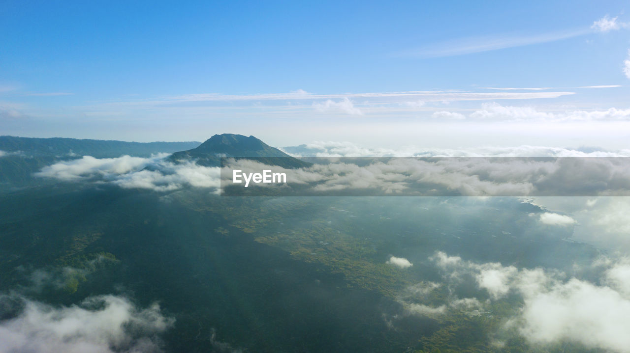 AERIAL VIEW OF CLOUDS OVER MOUNTAINS