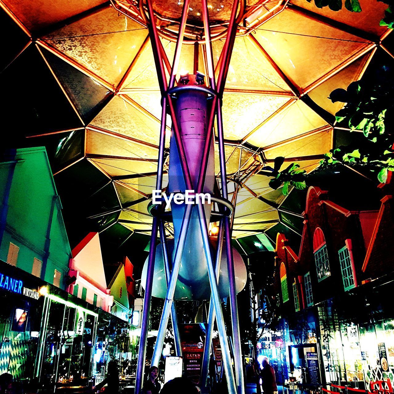 LOW ANGLE VIEW OF ILLUMINATED FERRIS WHEEL