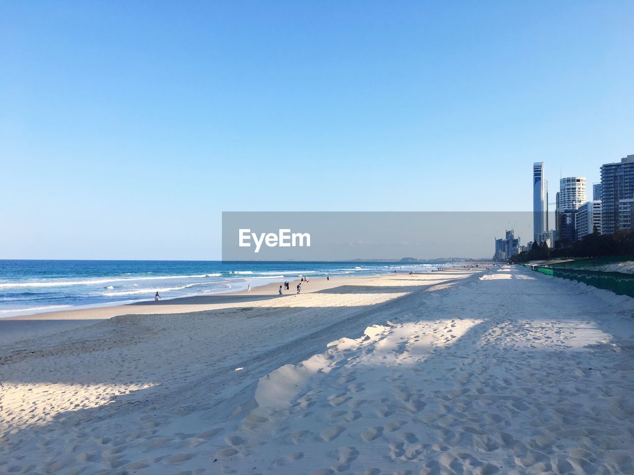 Scenic view of beach against clear sky