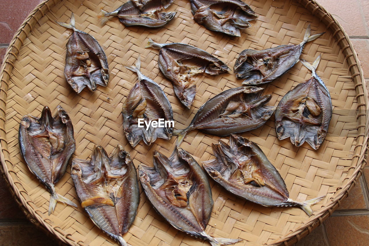 High angle view of fish on wicker basket