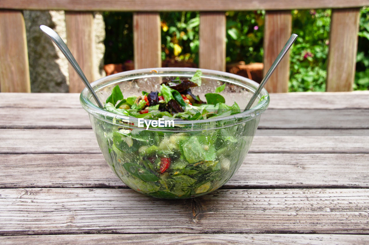 Salad in bowl on table