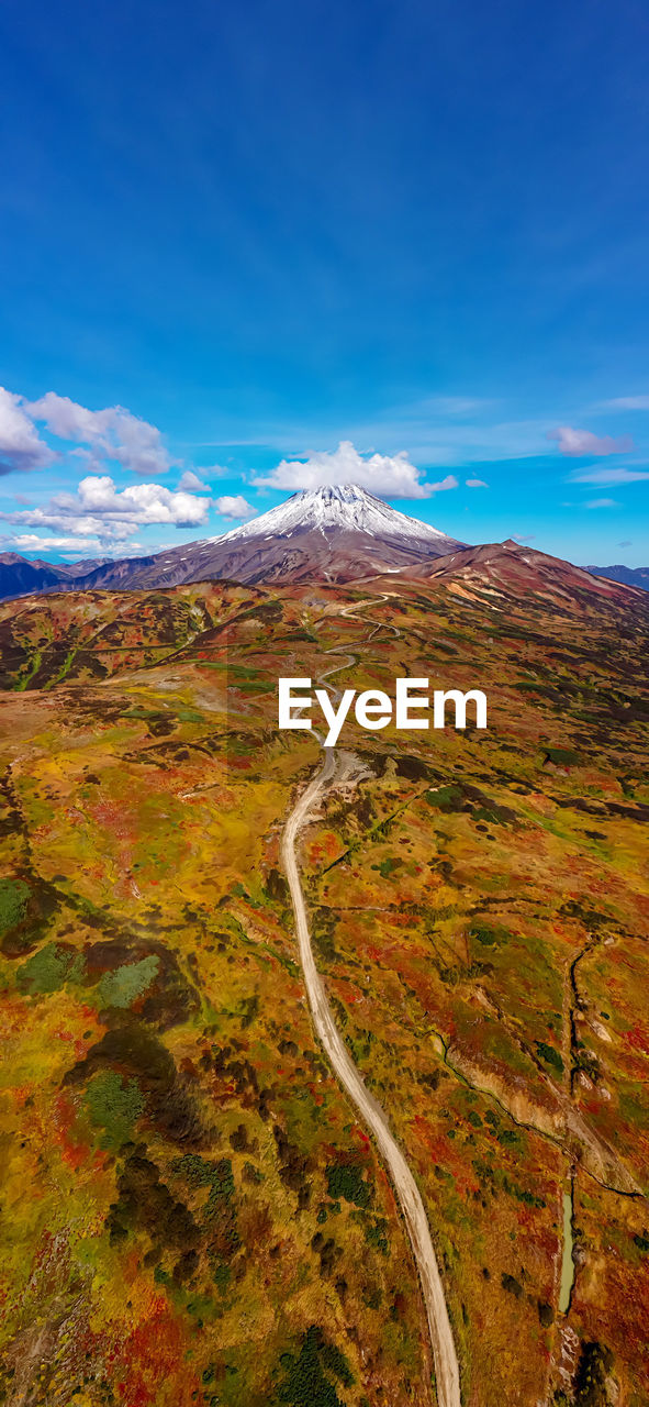 Scenic view of landscape against blue sky