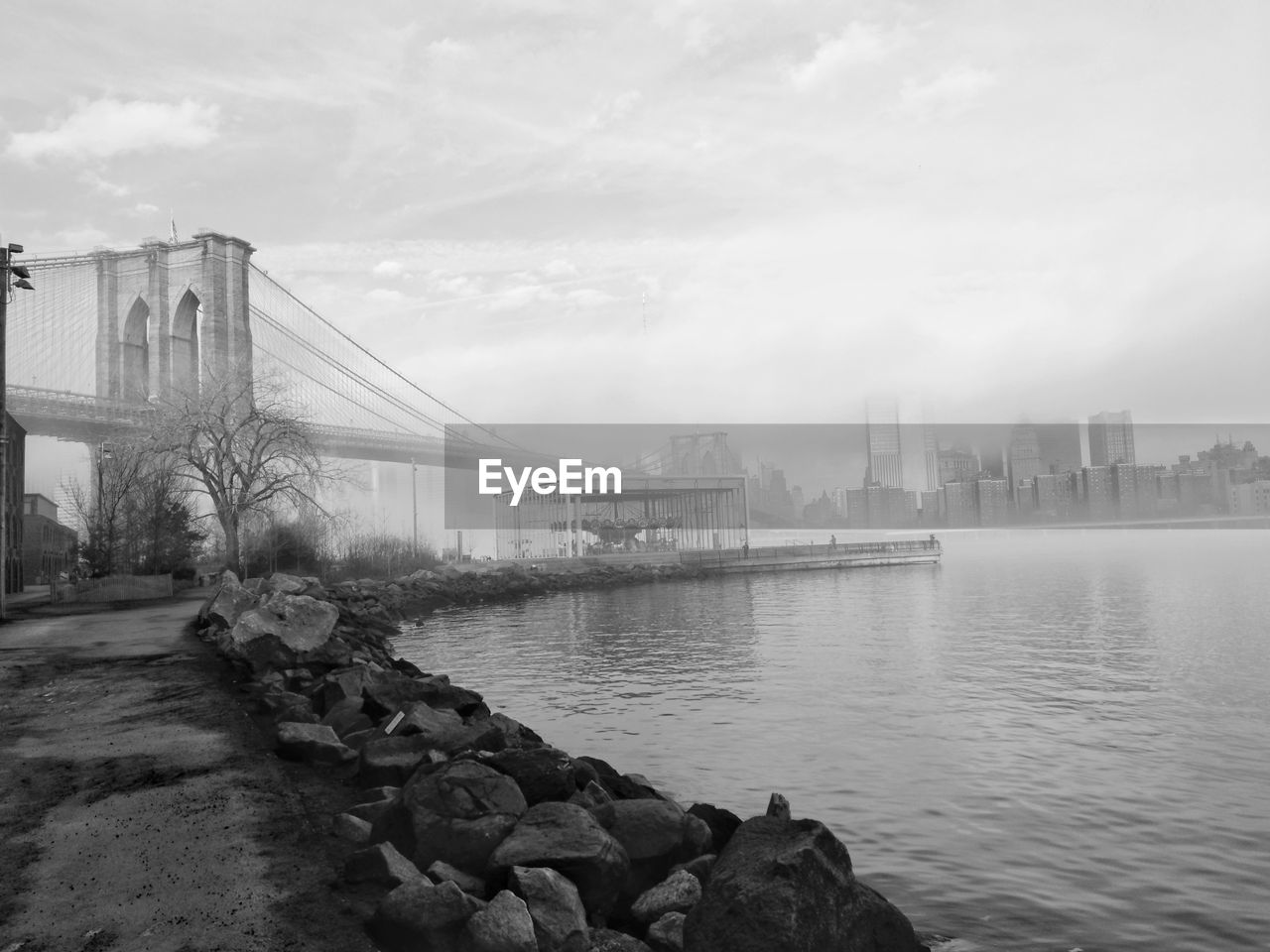 Bridge over river with city in background