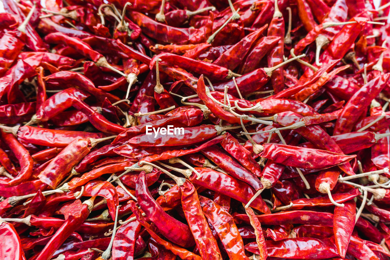 FULL FRAME SHOT OF RED CHILI PEPPERS AT MARKET