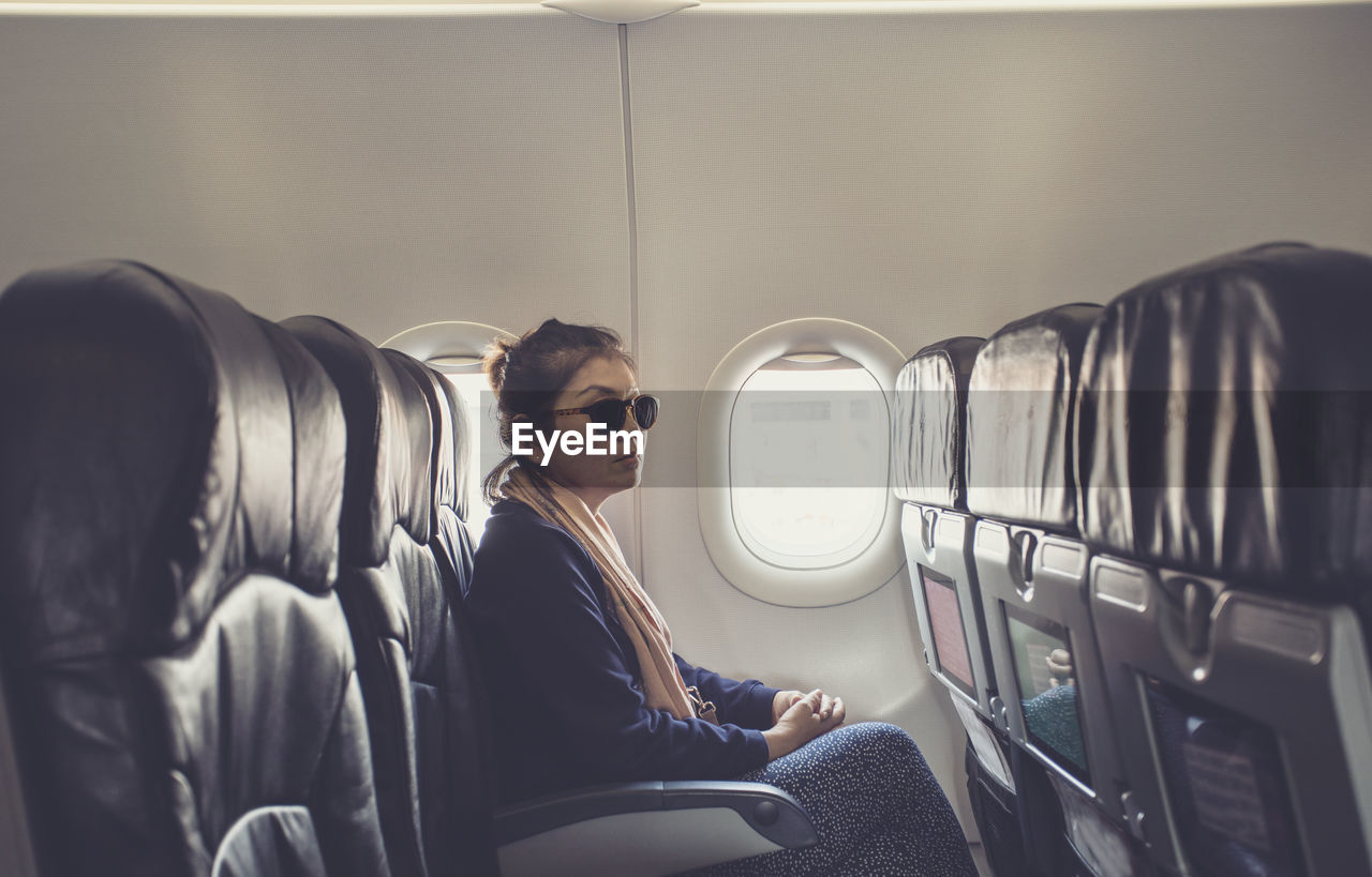 Woman sitting in airplane