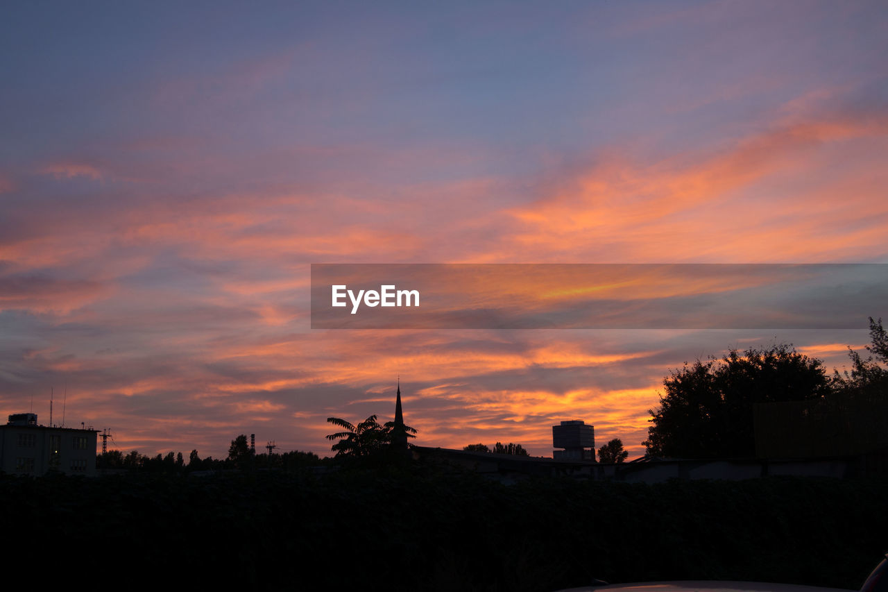 SILHOUETTE OF BUILDINGS AT SUNSET